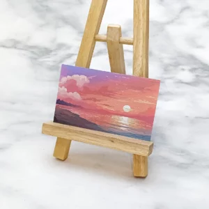 夕陽海景印刷畫作，色彩鮮豔，呈現寧靜的氛圍。