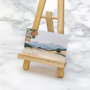 風景畫印刷品，以畫架展示。